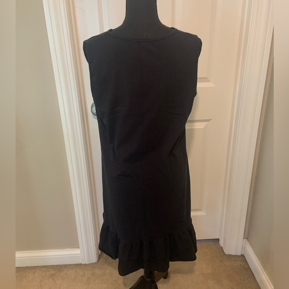Women’s black dress with ruffle hem